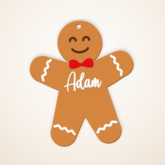 Gingerbread boy ornament with a red bow tie and white icing, named Adam