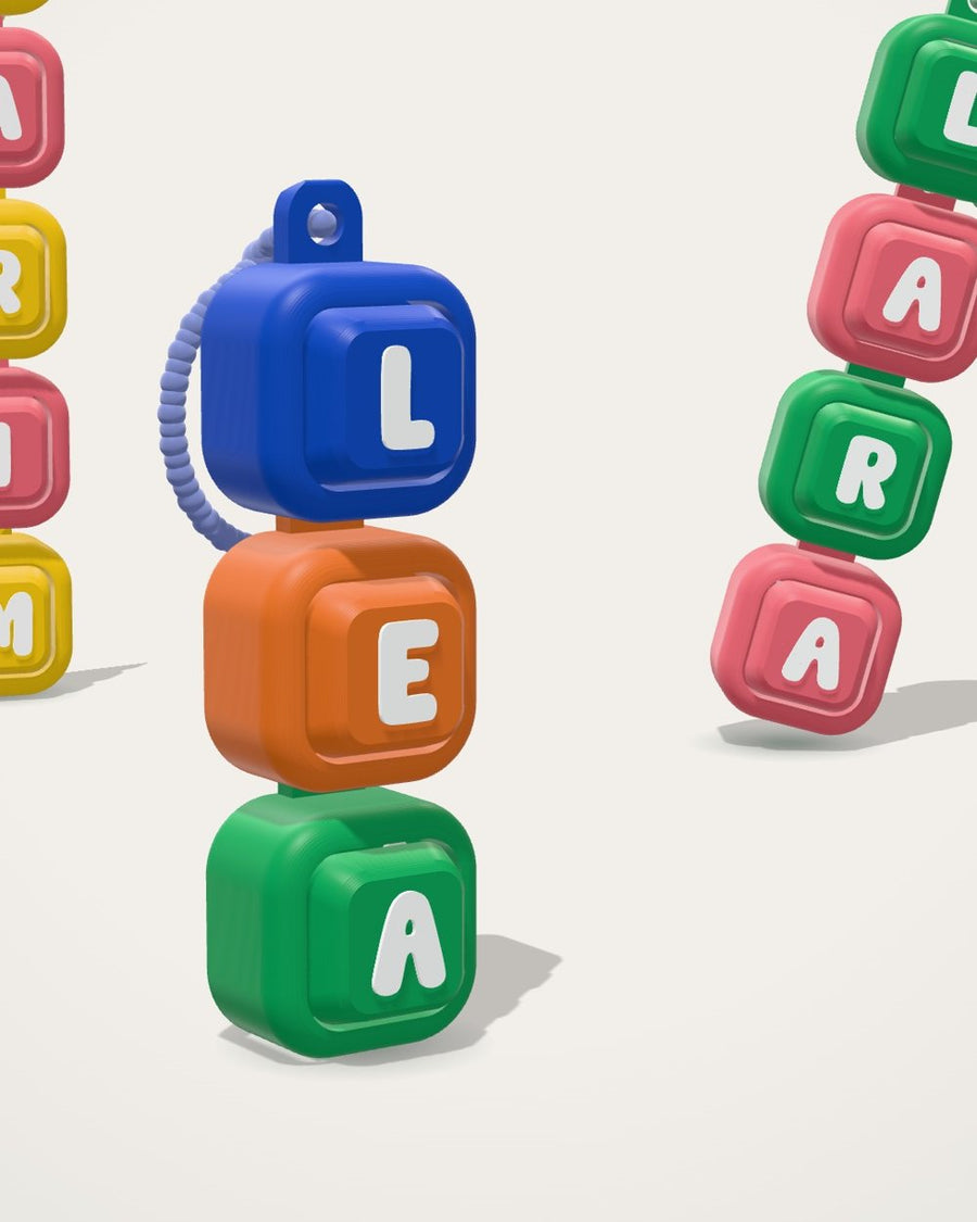 Colorful Squigli name clickers spelling names with symbols