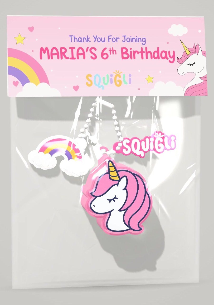 A unicorn return gift bag with a rainbow charm and a Squigli tag, under a header card for Maria's 6th birthday